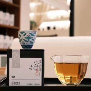 Wuyi Zhengshan Xiaozhong Red Tea - Xiaochigan is a distinguished variety of traditional Chinese red tea originating from the renowned Wuyi Mountains in Fujian Province. This tea is crafted using time-honored methods that have been passed down through generations, ensuring an authentic and rich flavor profile. The term "Xiaochigan" refers to a specific processing technique that enhances the tea’s natural sweetness and depth. When brewed, the tea liquor exhibits a deep amber or reddish-brown hue, often described as having the color of longan soup—a reference to the golden-brown shade of the traditional Chinese dessert made from dried longan fruit. This visual characteristic hints at the tea’s mellow and smooth taste, complemented by subtle fruity and honeyed undertones. The tea's aroma carries a delicate smokiness, a hallmark of traditional Wuyi red teas, making it a refined and enjoyable choice for tea enthusiasts seeking a balance of warmth and complexity in their cup.